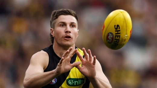 Richmond midfielder Liam Baker meets West Coast