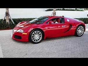 Birdman driving his Bugatti Veyron