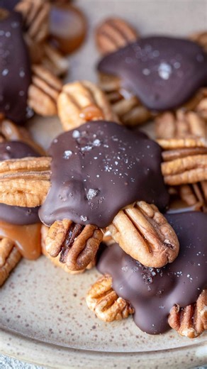 Sweet Peas & Saffron on Instagram: "I’ve got the cutest little holiday treats for you! These Pecan Turtles are super easy to make and great for cookie and candy exchanges! . ✨To get the recipe comment “recipe” and I’ll send it right your way, or visit: https://www.maebells.com/chocolate-pecan-turtles/ You will need: Pecan halves Caramel Bits Milk, just to thin the caramel Dark Chocolate Sea salt #recipe #christmas #candy #cookies #recipeshare #holiday"