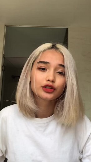 Engaging Hand Gestures in a Modern Bathroom Setting