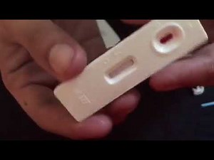Showing a POSITIVE result in a rapid HIV TEST kit