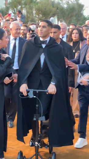 Footballer Achraf Hakimi Shows Up at the 2025 CAF Awards on a Knee Walker. | Wizzy B. Wears
