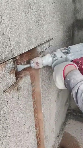 Drilling through a concrete wall to create a clean pipe path #popular #construction #drill #work