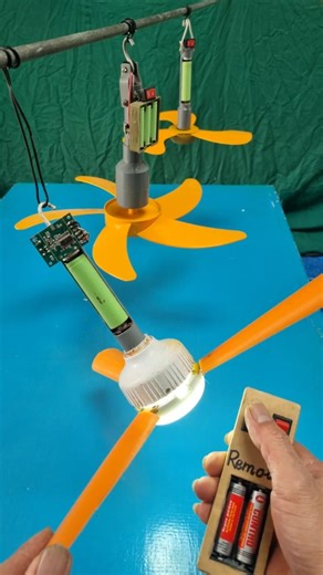 Three yellow ceiling fans and one remote control.