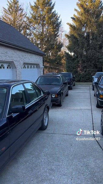 BMW Dealership Lineup Featuring E34 and E32 Models