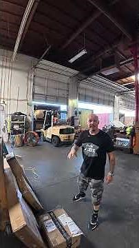 How are vehicles loaded into containers from the USA to France?
