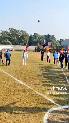 Young Woman Prepares for Discus Throw at Outdoor Event