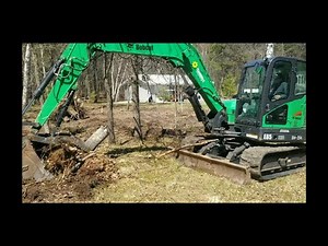 Bobcat E85 excavator digging stumps!
