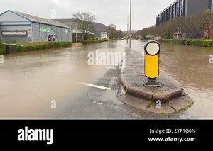 Treforest, Pontypridd, Wales, UK 24 November 2024: Fast flowing waters of the River Taff in flood after heavy rain from Storm Bert