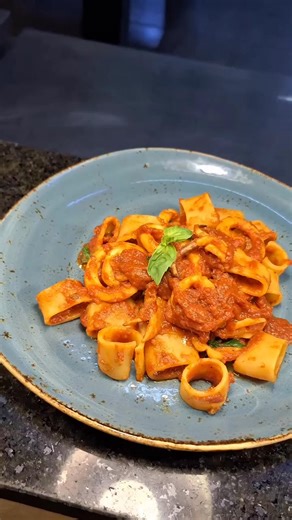The only rings we're obsessed with: Mambo Italia 's Calamarata. Pasta, fresh calamari, and a vibrant sauce of tomato, basil, and capers. It's simple, elegant, and insanely delicious. Come get a taste! #calamarata #calamaratapasta #pastalover #pastagram #nairobirestaurants #nairobidining #nairobi | Garden City Nairobi