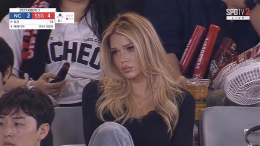 The KBO baseball AI fan cam trend has taken over social media in the last weeks, and it's genuinely hard to tell what's real.People are using AI to generate clips that look exactly like a live Korean baseball broadcast accidentally caught them in the stands, complete with stadium lighting, scorebugs, and cheering props.Millions got fooled when these first started dropping. Now everyone wants in.Russian influencer Esmi just posted her version and the internet is obsessed.