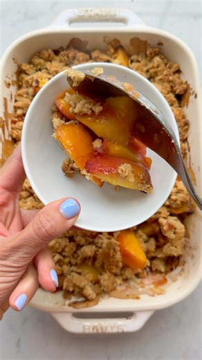 For an easy summer dessert, try peach crisp made with fresh ripe peaches and baked with a buttery crisp streusel topping; so good with vanilla ice cream! Comment “recipe” for a link to the full recipe.https://feelgoodfoodie.net/recipe/peach-crisp/ | Feel Good Foodie