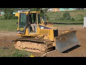 Caterpillar D5G Arrives on Trailer and Begins Backfilling/Grading