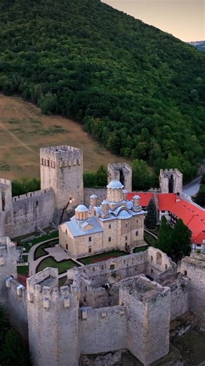 Manasija Monastery, a late-medieval Serbian gem, rises on a fertile Morava River plain near Despotovac, Serbia. Founded 1406–1418 by Despot Stefan Lazarević as his mausoleum and cultural hub, it blends Byzantine grandeur with Gothic flair—nine towers defend a fortified enclosure around a three-apse basilica. Highlights: the dazzling interior frescoes (1407–1420) depicting kings, saints and the epic Battle of Kosovo cycle; the octagonal refectory with stone-carved portals; and the 14th-century ic