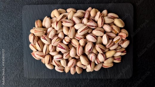 Salted pistachios in shells as a healthy, high calorie food ingredient. Pistachios as a food background for your design