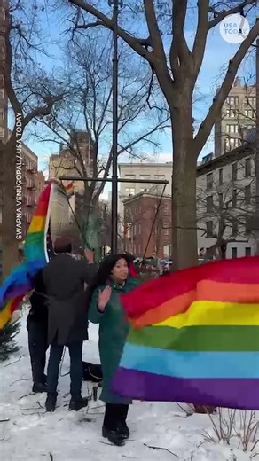 A Pride flag and American flag now fly together at Stonewall National Monument. Activists gathered to hoist the Pride flag after the National Park Service took it down. | The Palm Beach Post