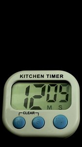 Download Time lapse of a kitchen clock timer countdown to zero. for free