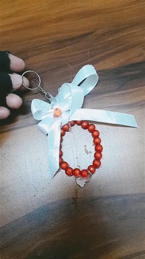 Diy۔bow۔keychin۔with۔pearls#bow۔keychin۔made# tutorial#diy# craft#yt shorts#diy# craft