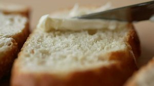 Download close up of butter spread on a bread for free