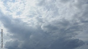 Clouds are floating across the sky, rain is gathering. The weather is getting worse. Climate change. Real time. Slow cloud movements Clouds are forming. High quality 4k footage.