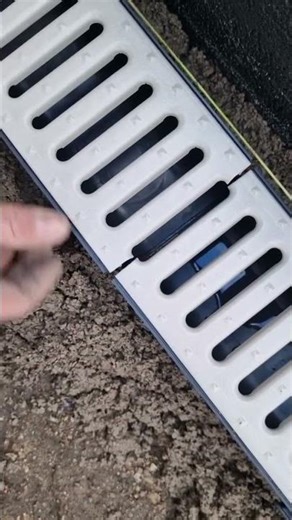 the process of installing a water channel next to the house #construction #popular #viralshorts