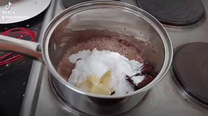 CHOCOLATE FUDGE FROSTING RECIPE Perfect for decorating and piping to give you that ultimate rich, yummy, gooey, chocolately experience. 1/2 cup fresh cream 220gm dark chocolate 1/2 cup margarine 1/2 cup icing sugar 1/2 teaspoon coffee 2 teaspoons cocoa 1 teaspoon vanilla #chocolatefudge #chocolatefrosting #caketutorial #247naijacakeaffairs | The Cake Junction