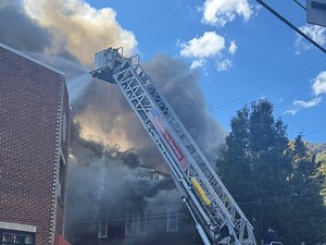 Excavators called to assist with fire at old Webster Hotel
