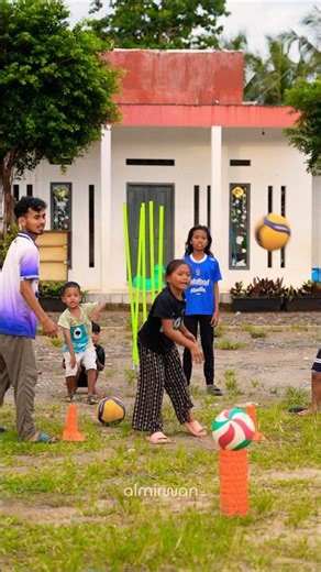 Septi Gebot Booms spikes a volleyball on the court