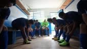 Soccer team preparing for match in the locker room