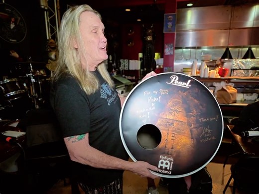 IRON MAIDEN's NICKO MCBRAIN Receives Signed Drum Head From KAI HAHTO Of NIGHTWISH