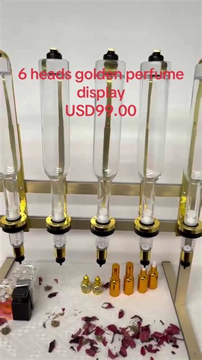 Stylish Golden Perfume Display for Fragrance Lovers