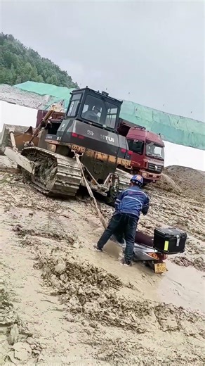 Bulldozer to the Rescue! Stuck Scooter Finally Pulled Out