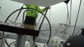 A sailor sailing a boat in a severe storm.