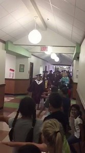 7.3K views · 257 reactions | Happening now...Lockhart High School graduates walk the halls of Bluebonnet Elementary School. This annual tradition encourages our younger Lions to see themselves in the future! #RightNowLISD | Lockhart ISD | Facebook