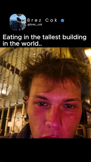 Brez Cok on Instagram: "Eating in the tallest building in the world 💀 — that’s not just dinner, that’s a statement. Brez walks in like it’s a normal day, but he’s literally 160+ floors up, above the clouds, eating steak with a view that most people only see in wallpapers. The city looks tiny, the lights look endless, and every bite comes with a side of altitude. 😭 Waiters are moving in silence, the windows are fogged from the height difference, and the food? Probably costs more than a month’s 
