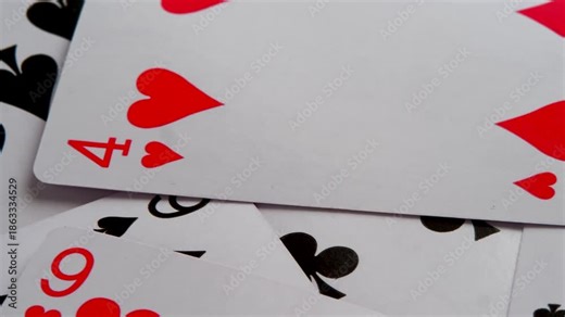 Rotating playing cards in close up view. conceptual video symbolizes luck, fate, probability, making it useful for abstract visual storytelling in business, finance, casino themed projects