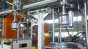 Real shot assembly line inside automated robotic assembly machine of motor coil in a factory production process automobile manufacturing plant