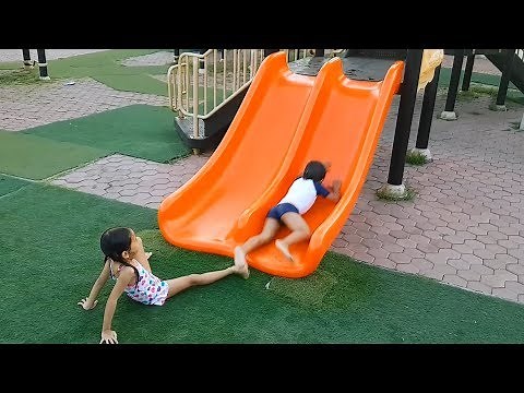 Playing in Rainy Waterpark Playground Slides with Funny Kids - Donna The Explorer