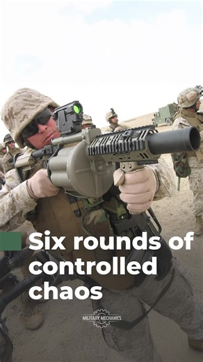 The M32 grenade launcher is a six-shot 40mm revolver weapon providing rapid area suppression with explosive, smoke, and illumination rounds.