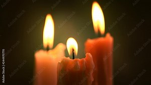 Candle flame closeup on a dark background. Candle light border design. Melted wax candles burning at night. 4K UHD video footage. 3840X2160