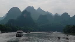 Cruise boat along the Li river among the famous karstic landscape...