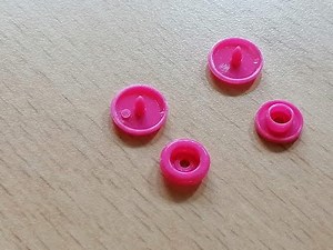attach a plastic snap fastener