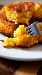 Old-School Hot Water Cornbread Ingredients: - 2 cups cornmeal - 1 teaspoon salt - 1 teaspoon baking powder - 2 cups boiling water - Optional: honey butter for serving - Oil for frying Directions: 1. In a mixing bowl, combine 2 cups of cornmeal, 1 teaspoon of salt, and 1 teaspoon of baking powder. 2. Gradually pour in 2 cups of boiling water while stirring until a thick batter forms. 3. Allow the mixture to rest for about 10 minutes. 4. Heat oil in a frying pan over medium heat. 5. Drop spoonfuls