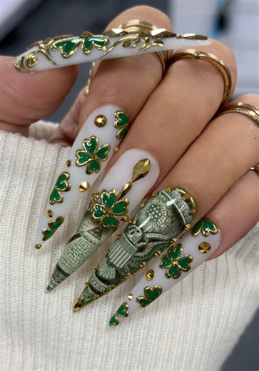 Using my sticky gel with FAKE money for this money clover☘️ 😍 🛍️Product Included available only at www.TinoVo.shop ⬇️ • 1. Apply milky gel color for foundation 2. Apply sticky gel on the surface and cure 3. Apply sticky gel on the back of money and cure 4. Cut out money (fake) and stick it on the nail 5. Use shine it topcoat to secure the edges 6. Apply 3d gelly to smooth the surface 7. Use teflon matte to isolate chrome 8. Apply black metal effect gel for chrome design 9. Rub on gold solid ch