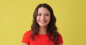 Woman shaking head and saying yes