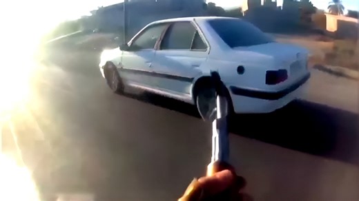 Caught on camera: Iranian cop chased, shot dead in drive-by attack amid protests
