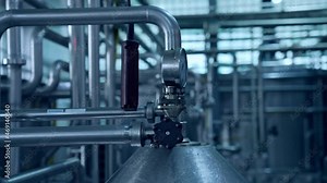 Industrial mechanism on a dairy farm. Modern equipment inside the milk farm. Production of dairy products. Food production industry.