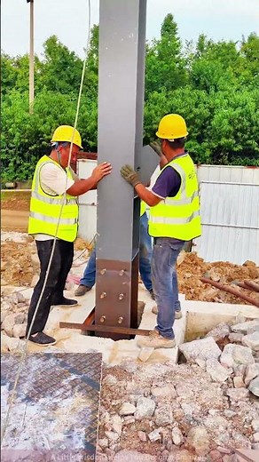 Construction workers precisely install steel column—detailed construction process!