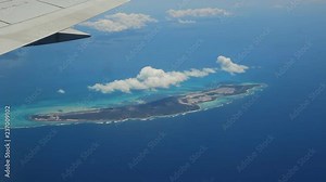 Flying over the island of Anegada in the British Virgin Islands with view of jet wing. Anegada is the northernmost of the British Virgin Islands.