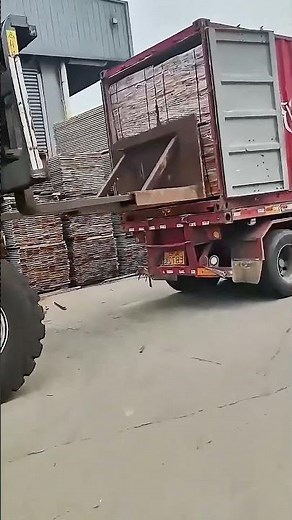 The process of loading timber on a forklift
